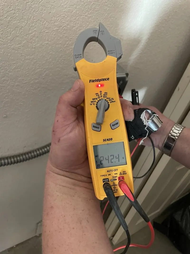 Voltage testing with clamp meter during Electrical Installation Services in La Grande
